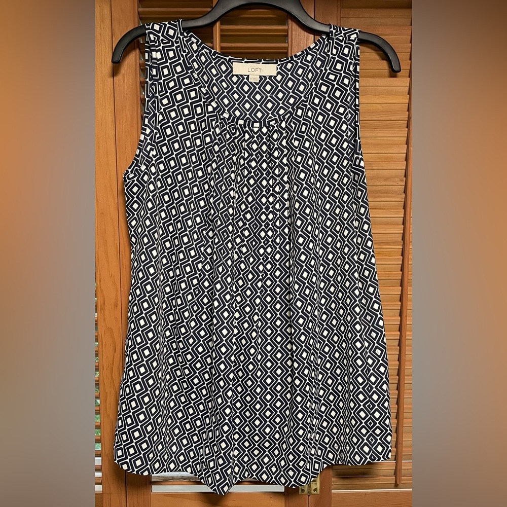 Women’s Loft blue and white patterned sleeveless blouse; size M